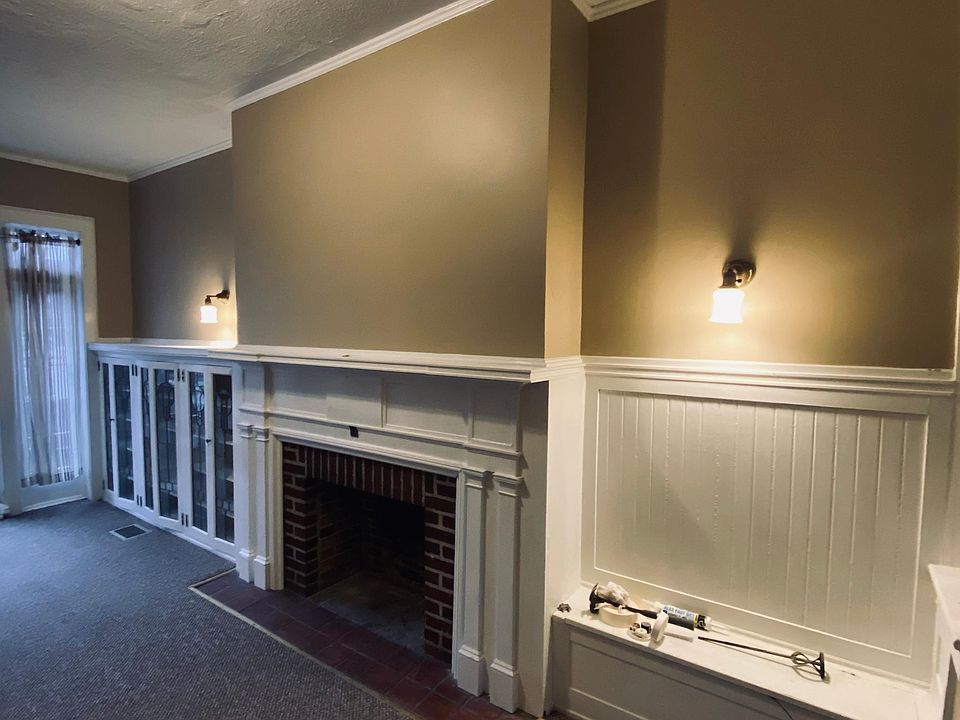 Living Room w/Built-in Book Cases and Original Brick Fireplace 
(Fireplace is decorative only and can not be used)