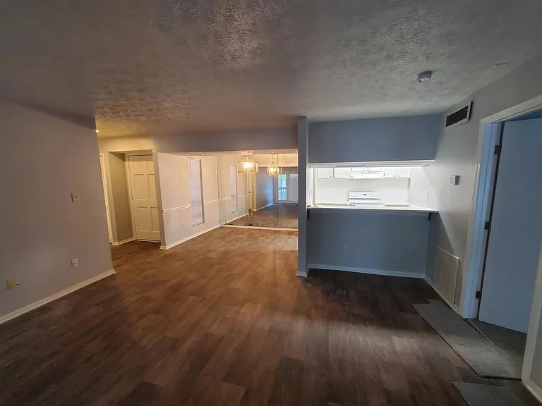 View from large family room towards kitchen and dining