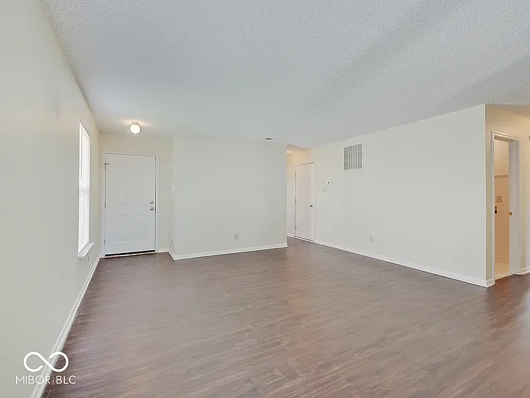 front entry and living area view from kitchen