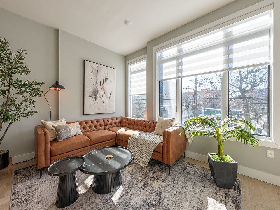 Light filled Living Room with motorized shades.