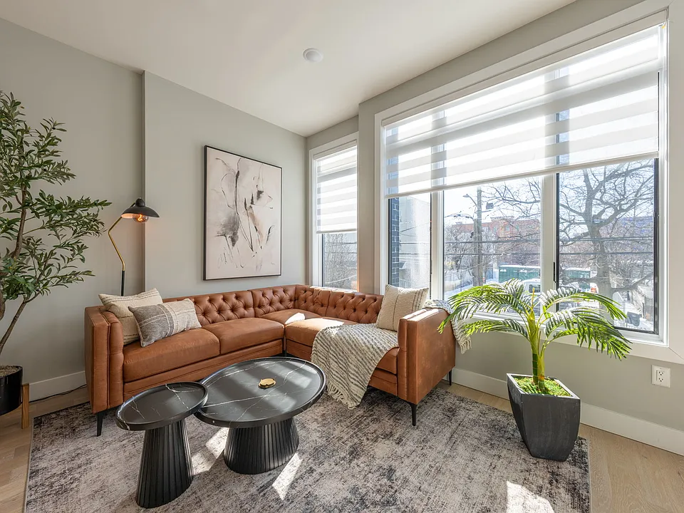 Light filled Living Room with motorized shades.