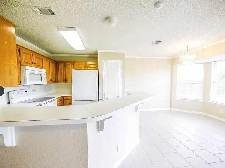 Bright kitchen includes all appliances & dinette.