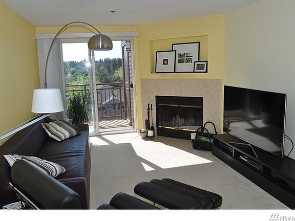 Light and bright living room with a wood-burning fireplace!