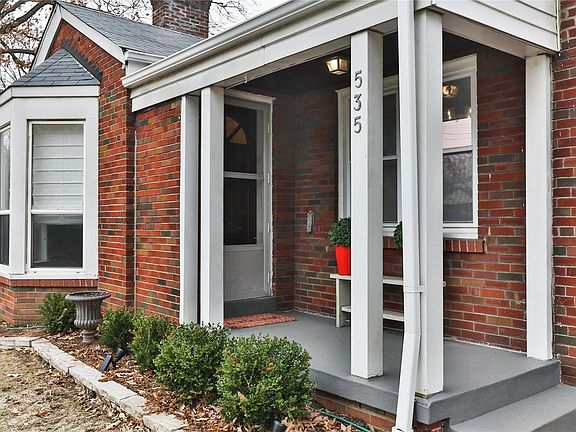 Sweet covered porch leading to the front door