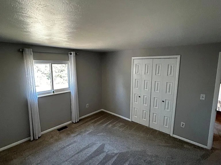 first bedroom upstairs with closet