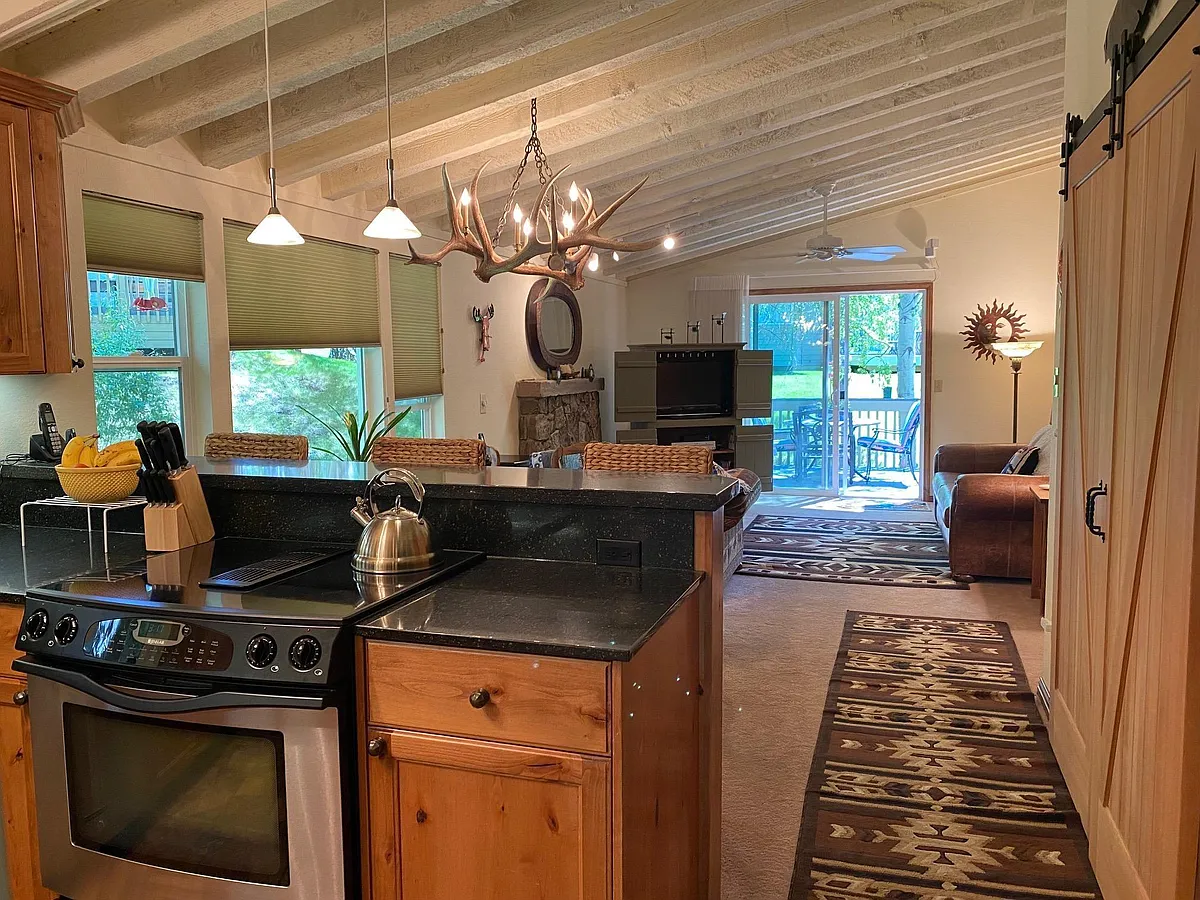 Cozy Great Room with rustic beam ceilings! And Brand New Hardwood Floors! - 3628 Ranch Ct