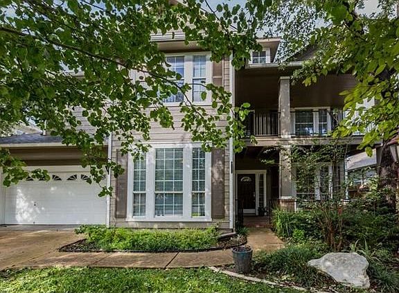 Pristine, charming home with lush landscaping and mature trees.  Four covered porches to drink in the outdoors.