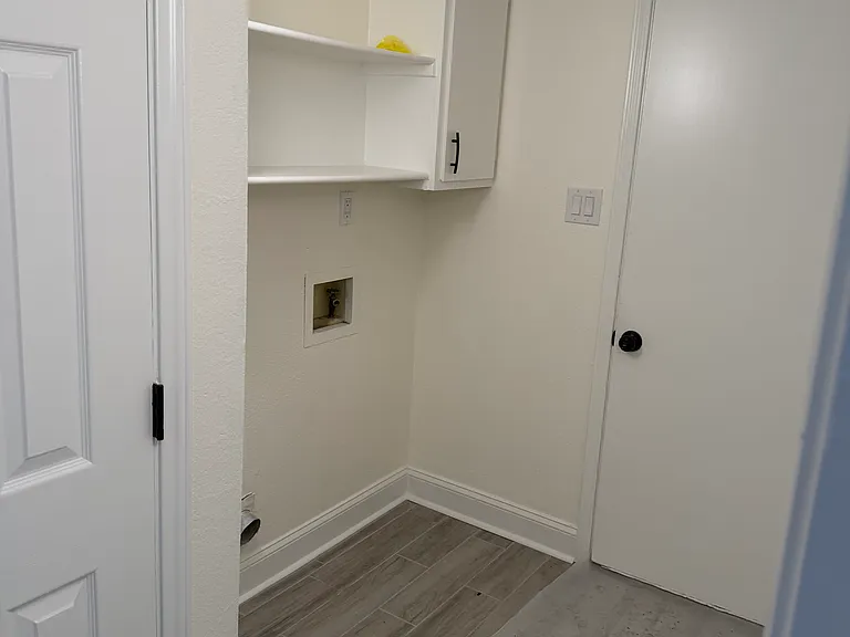 Utility Room - entrance to garage and storage area