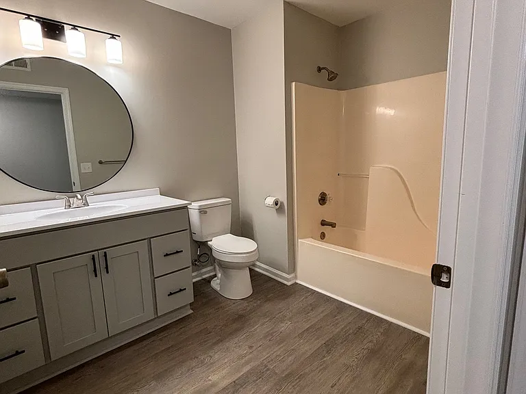 Spacious and stylish bathroom features modern fixtures