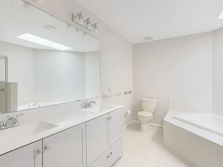 Spa-Like Primary Bath With w/Double Vanity and Jetted Tub.