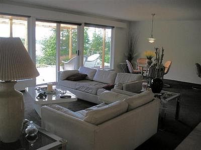 Open style living & dining has new carpet & looks out to views