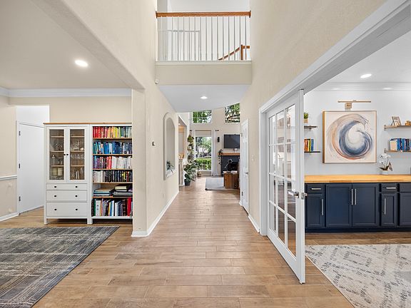 Two Private Downstairs Offices: Perfectly designed for today's work-from-home needs or creative endeavors, offering peace and productivity.