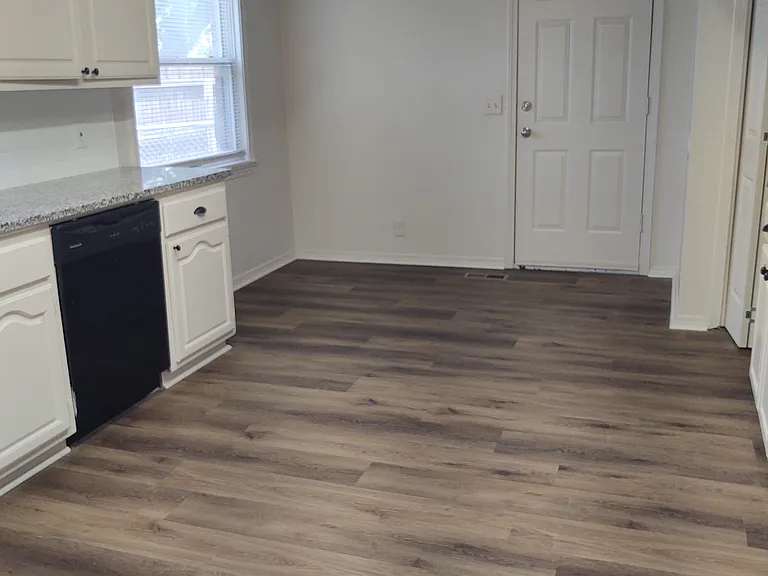 View of kitchen towards garage and nook area.