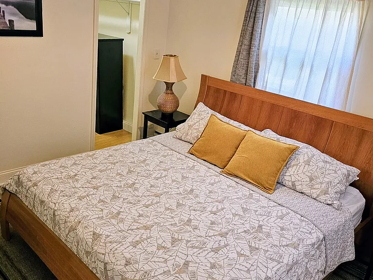 Master bedroom suite includes cherry king size bed, walk in closet and private full bath with tub/shower combination