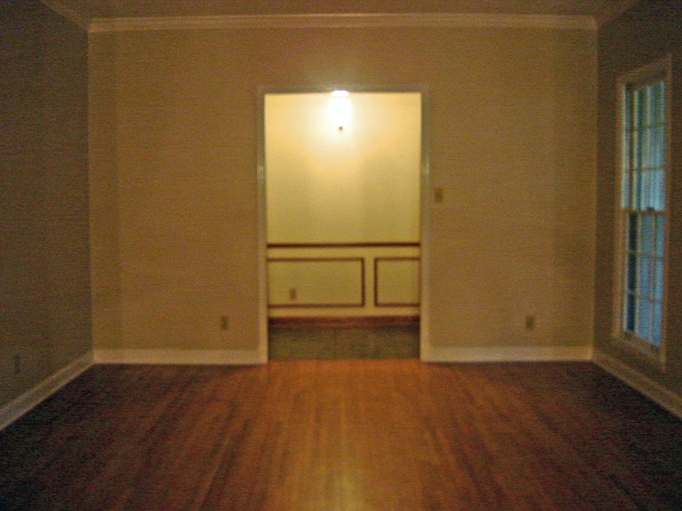 Living Room has custom molding and rich hardwood floors