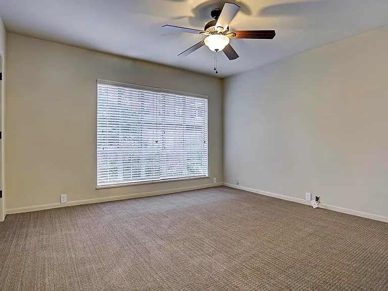 Primary Bedroom with 2 closets, and an oversized window