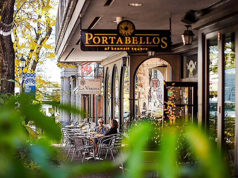 Enjoy a delightful dining experience in this charming outdoor cafe setting.