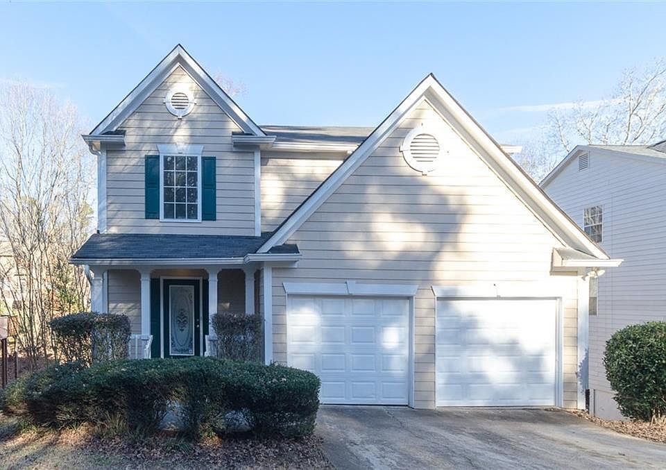 Leveled driveway and small porch in the front of the house
