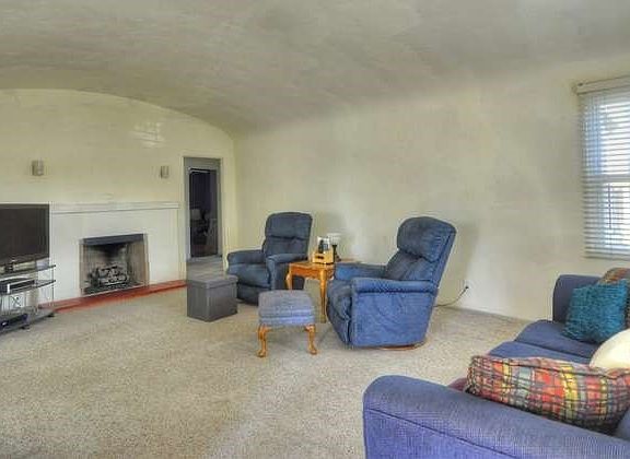 Another view of living room toward fireplace.  Again, great natural light...