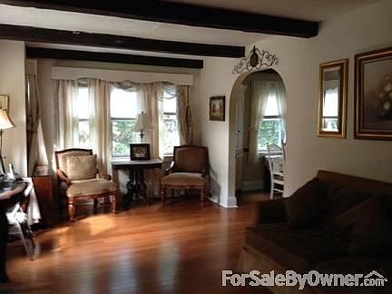 Living Room Charm
						:
						Beautiful New Hardwood Floors extending into dining room