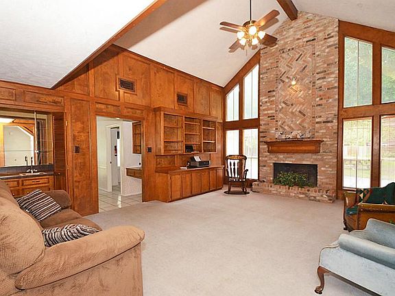 21x16 Den has brick fireplace.