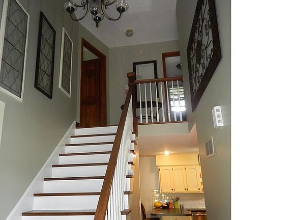 Welcoming entry to 200yr old wood floors, sweeping staircase, new lighting