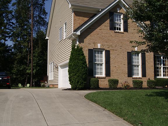 view of driveway with garage
