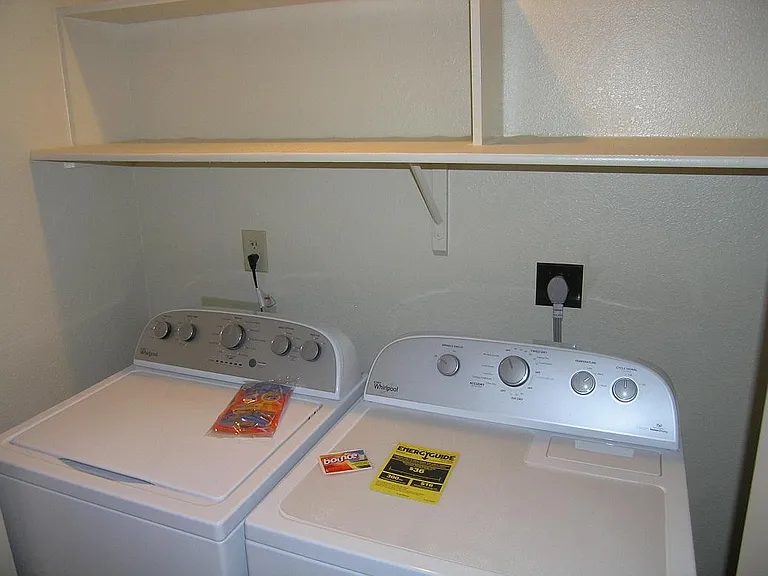 Laundry room with full-size washer and dryer