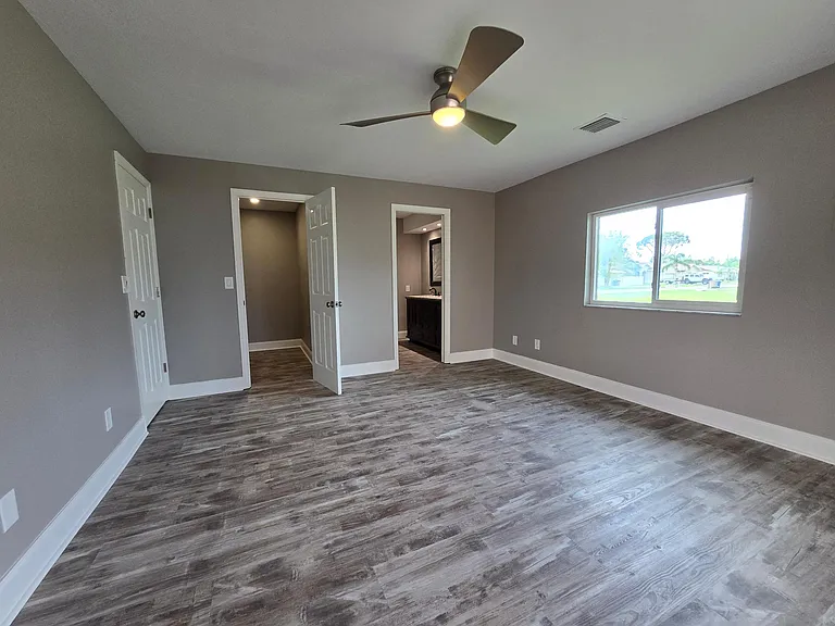 Master bedroom with walk-in closet and private bath