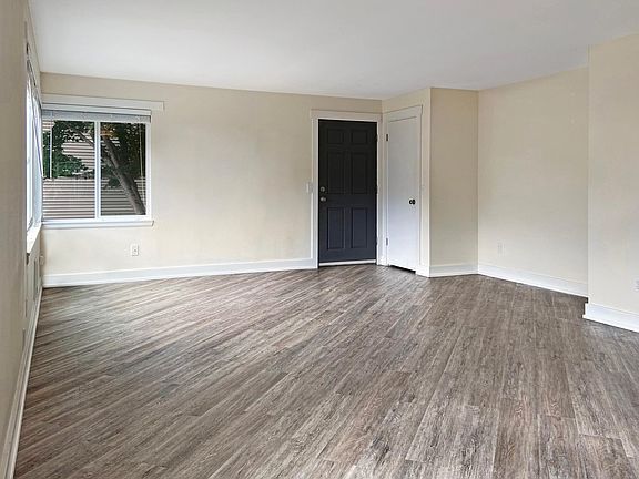 Large living room with new hard surface flooring.