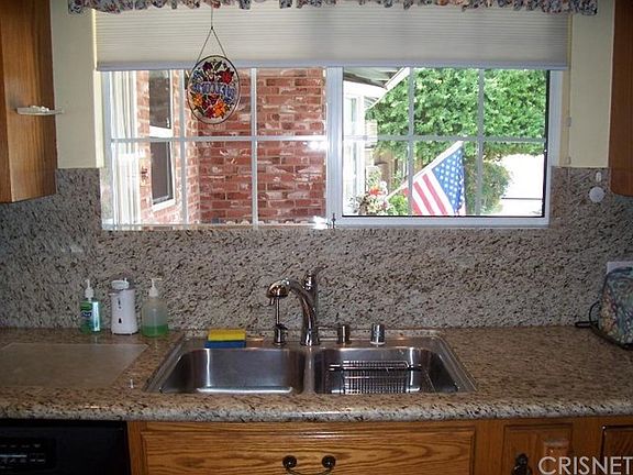 View of porch from kitchen sink