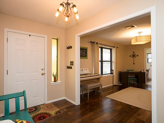 Beautiful entry updated with fresh paint, modern fixtures and wood flooring