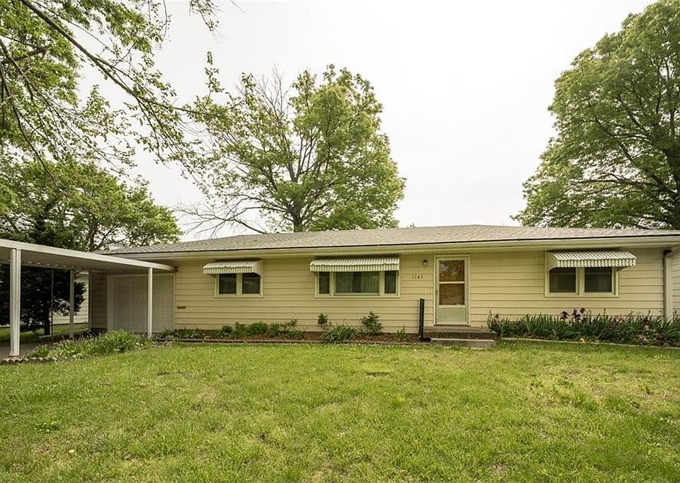 Additional carport overhang attached to the one car garage.  Home also has maintenance free siding.