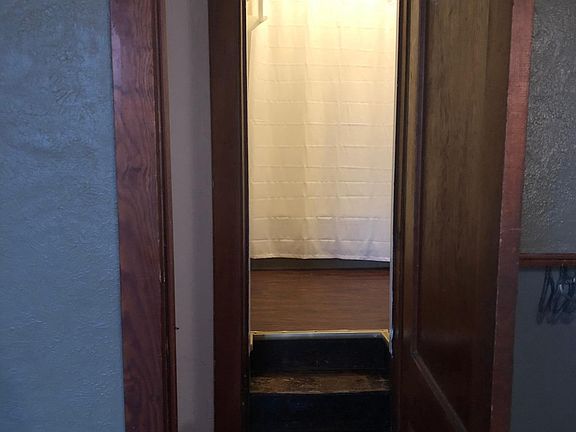 Large closet/storage area leading up to bathroom 