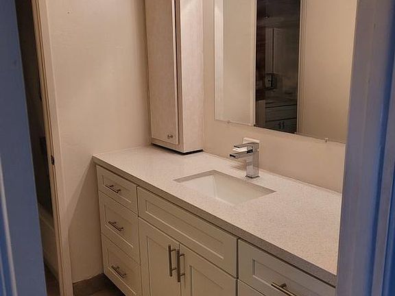 Additional dressing area across from walk-in closet
