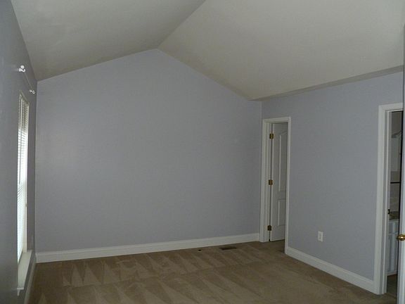 3rd level bedroom with walk-in closet and shared bath