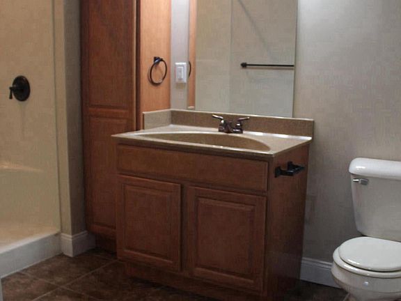 Walk-in shower - Tile in both bathrooms, kitchen and laundry
