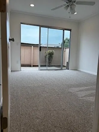 Middle bedroom with view to back patio