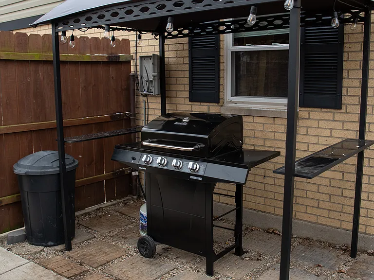 Your private backyard oasis, featuring a hot tub, stone patio, and plenty of space to relax.