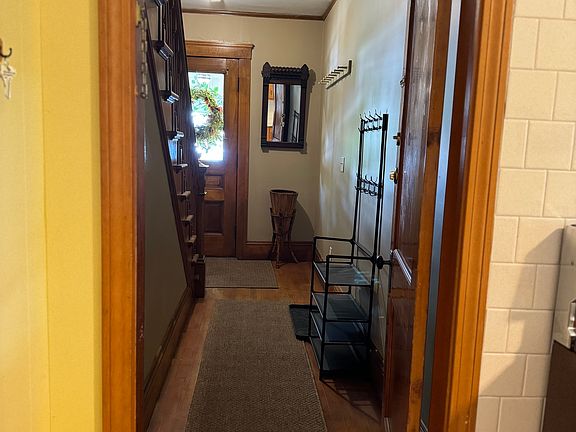 This hallway leads to the front door entrance.
