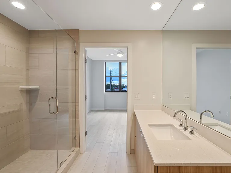Discover a home with walk-in showers and ample natural light.