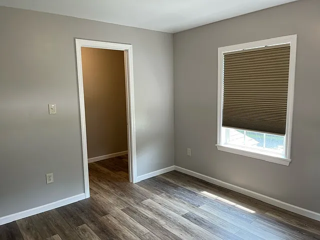 1st bedroom with large walk in closet. Shelves and door not shown.