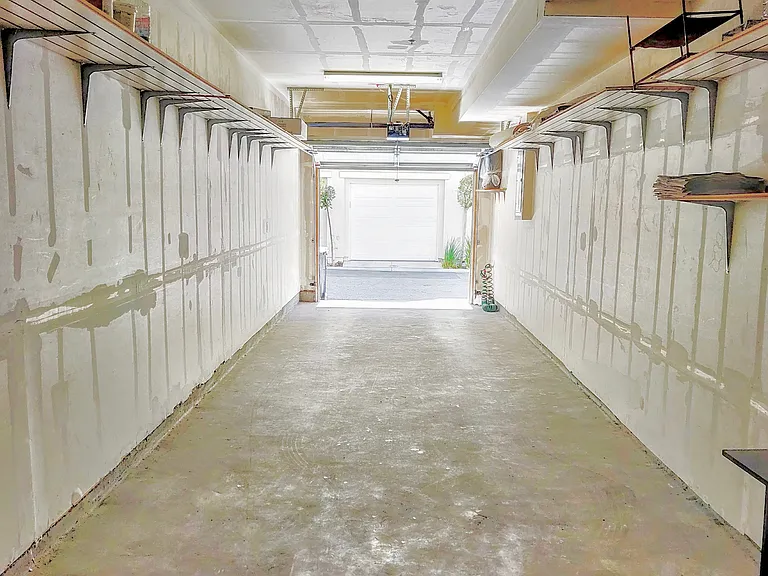 Attached 2-car tandem garage provides secure parking, protection for your vehicles, and plenty of extra space for storage.