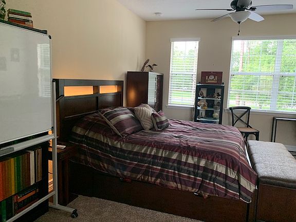For size perspective, same unit with a corner desk with chair, 2 dressers, a storage bench, stereo cabinet, book case, twin accent sleeper chair, dinner table with 3 chairs and an additional office chair.