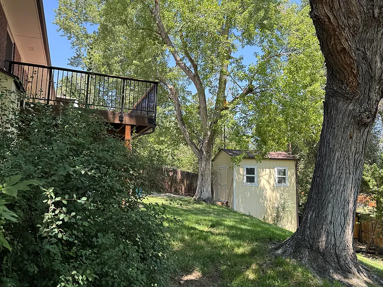View from East side of walkway to deck and shed