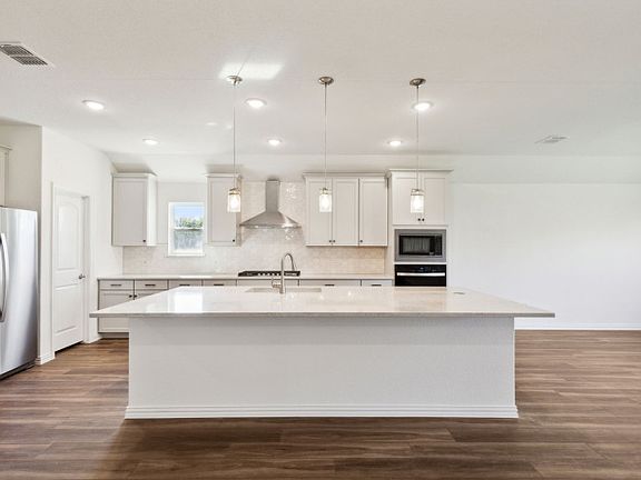 Expansive kitchen with ample cabinet space