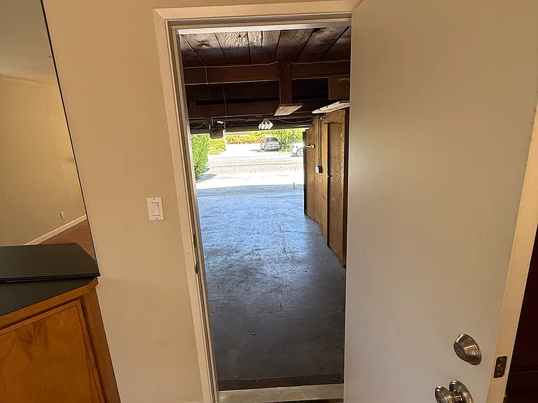 fire to code Door to 2 car garage with plenty of storage, cabinets and attic. Washer and Dryer located in garage as well
