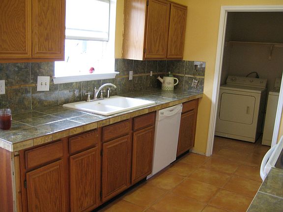 Kitchen looks to Backyard