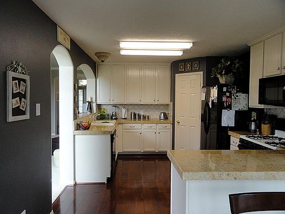 VIEW OF KITCHEN FROM BREAKFAST AREA