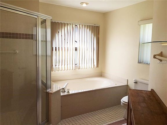 Master Bath that features whirlpool tub, walk in shower and extra cabinetry.